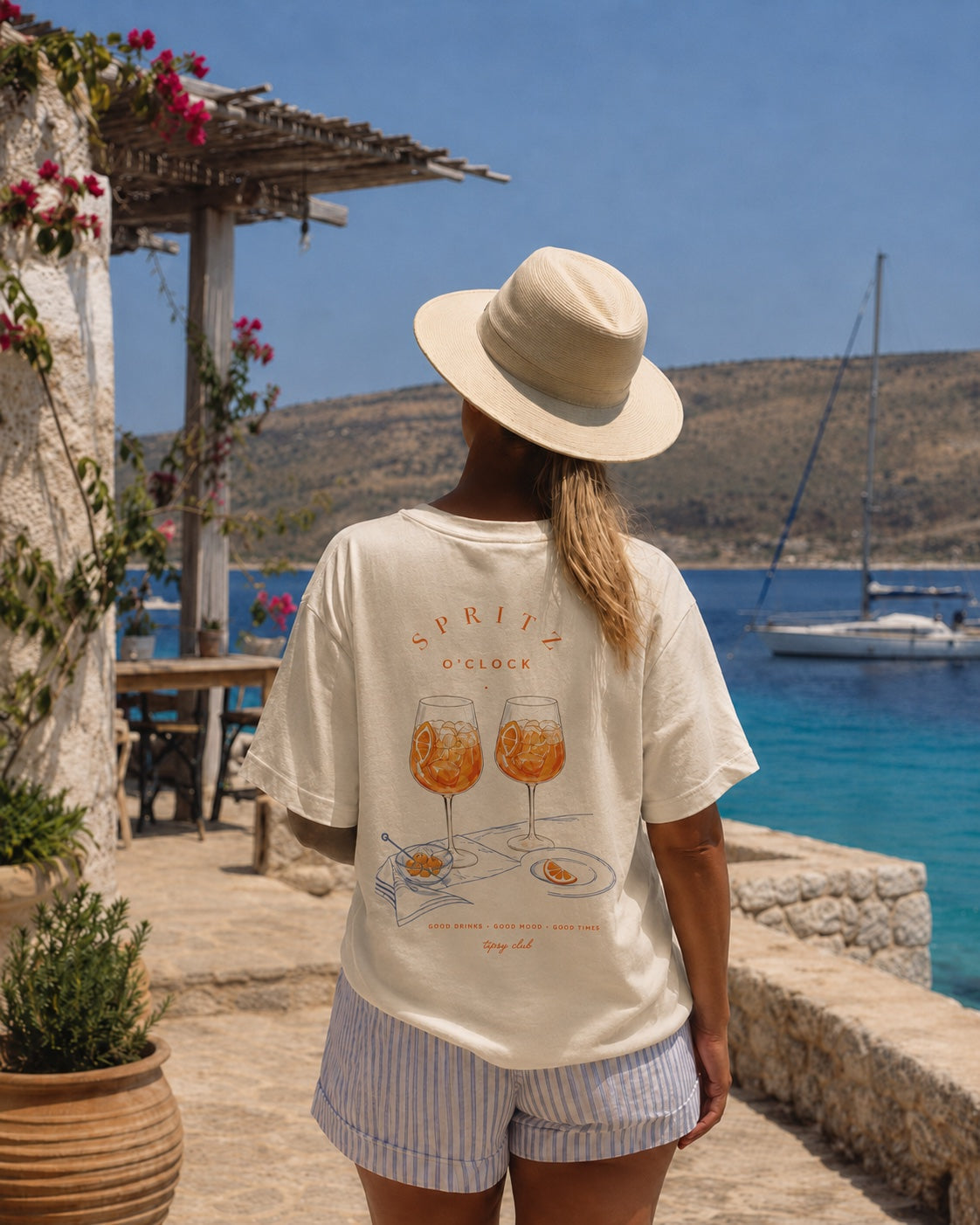 Spritz O'Clock heavyweight tee worn above the Mediterranean sea