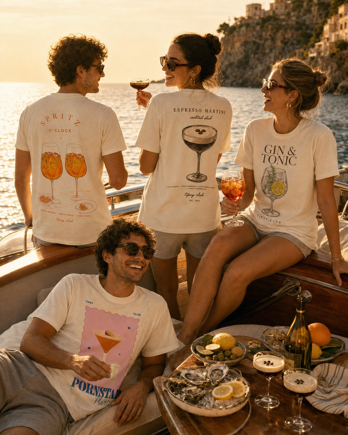 Group on a boat wearing Spritz O'Clock and Gin & Tonic back prints
