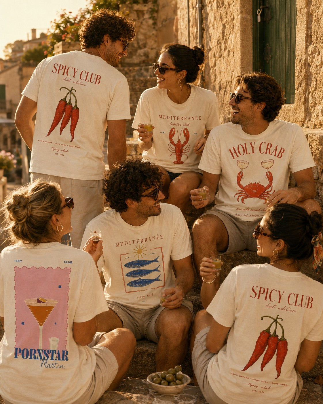 Friends in a whitewashed alley wearing Spicy Club and Holy Crab back prints